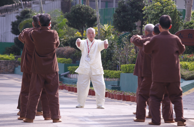 A volunteer teaches elderly persons in custody Tai Chi at “Evergreen Garden” at Tai Lam Correctional Institution, helping them build up their confidence.