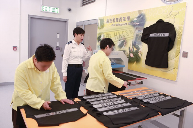 Windproof and vapour permeable jackets with heat transfer printing method for reflective strap are produced at Lo Wu Correctional Institution under strict production procedures.
