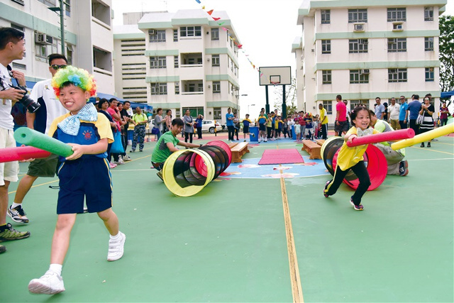 The children play joyfully on a family fun day organised by the Department, which aims to promote a healthy and balanced lifestyle among staff.
