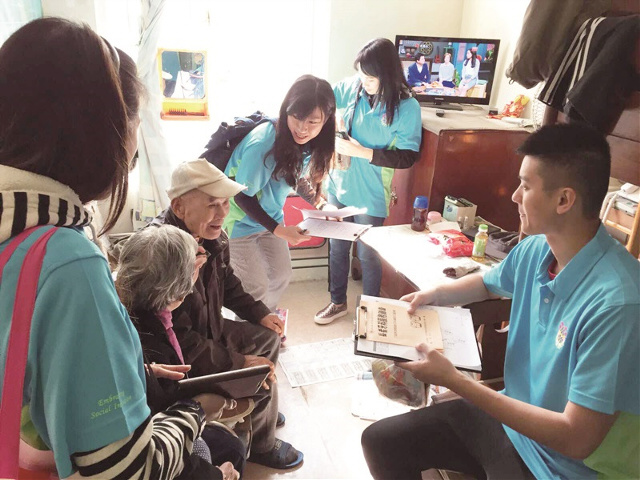 Volunteers from the Oi Kwan Volunteer Group Limited visit the elderly to care for their needs