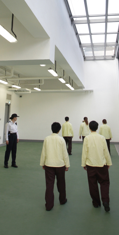 Persons in custody walk at the newly built exercise yard at Tai Lam Centre for Women.