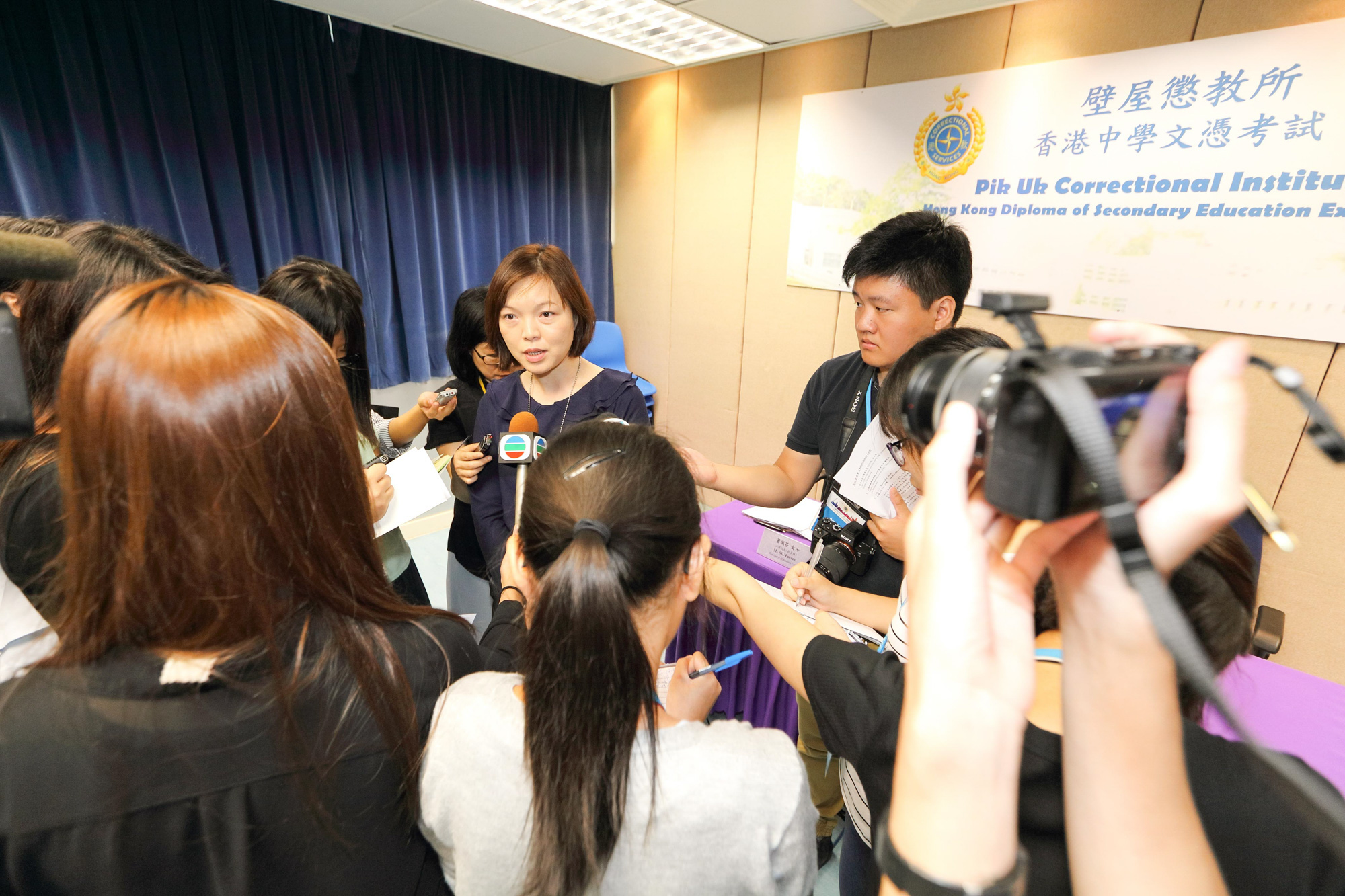 Media representatives covered the young persons in custody receiving the results of the Hong Kong Diploma of Secondary Education Examination at Pik Uk Correctional Institution on July 12, 2017.