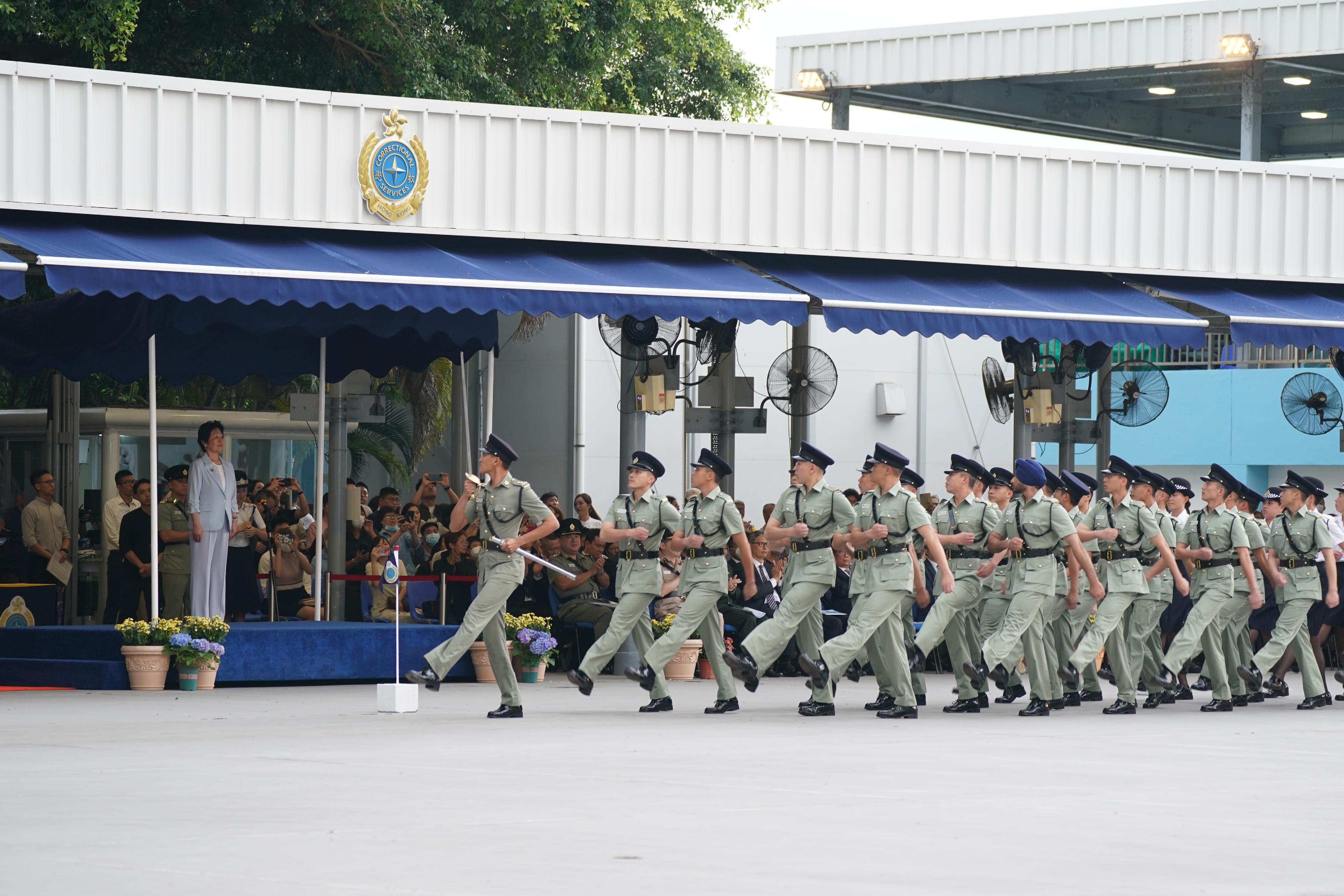 The Correctional Services Department held a passing-out parade at the Hong Kong Correctional Services Academy today (April 21). Photo shows the parade marching past the dais.
