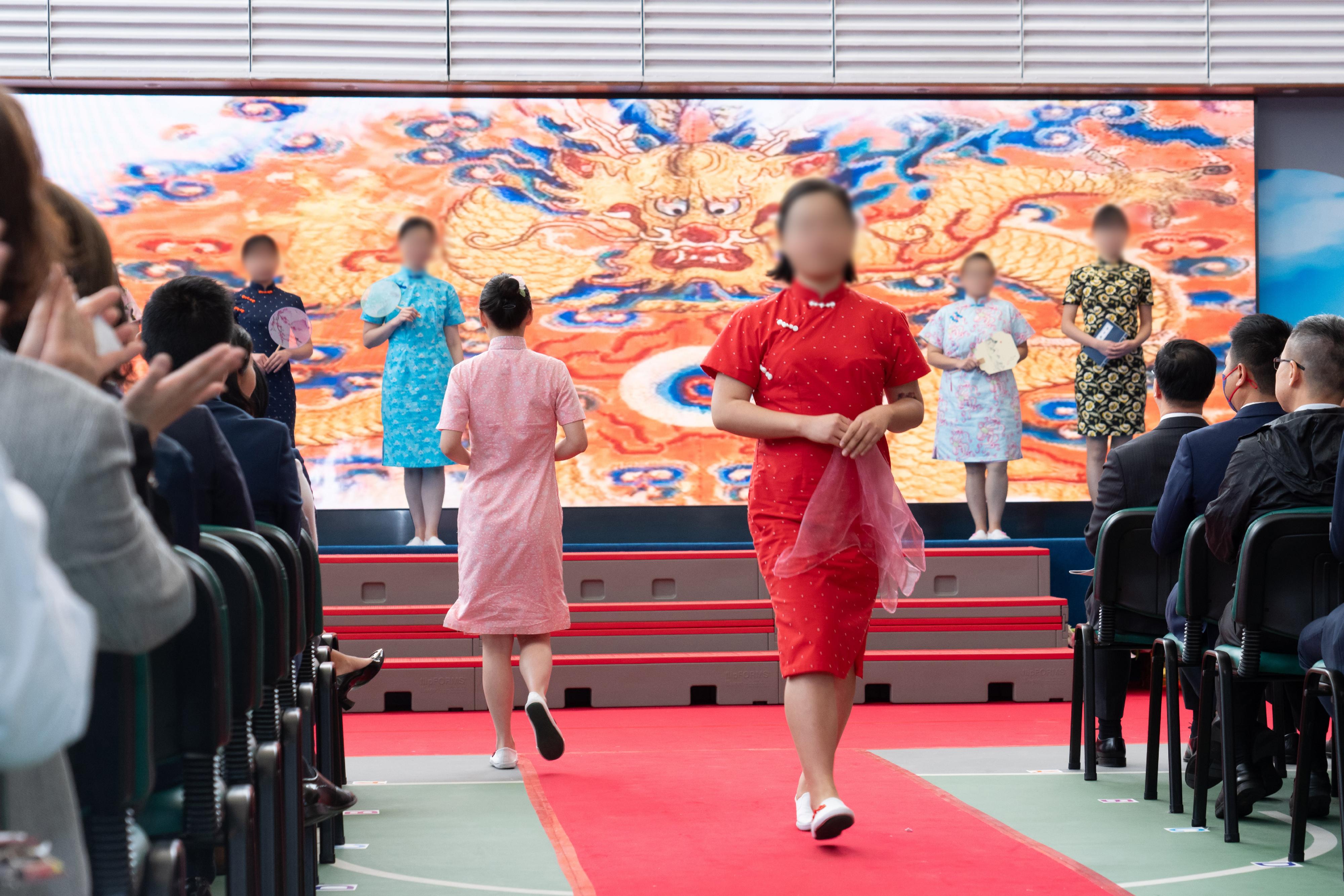 Persons in custody at Lo Wu Correctional Institution of the Correctional Services Department were presented with certificates at a ceremony today (March 20) in recognition of their continuous efforts in pursuing further studies. Photo shows persons in custody demonstrating the cheongsams they made in a fashion show.