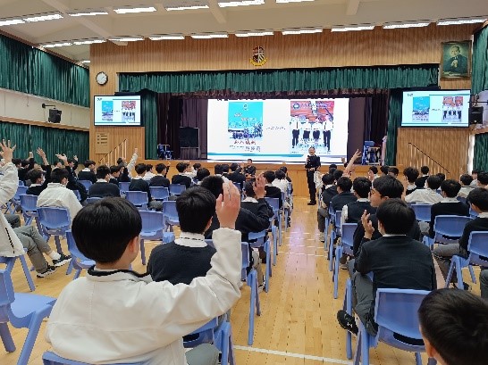 A graduate returns to her alma mater in uniform and hosts an education talk