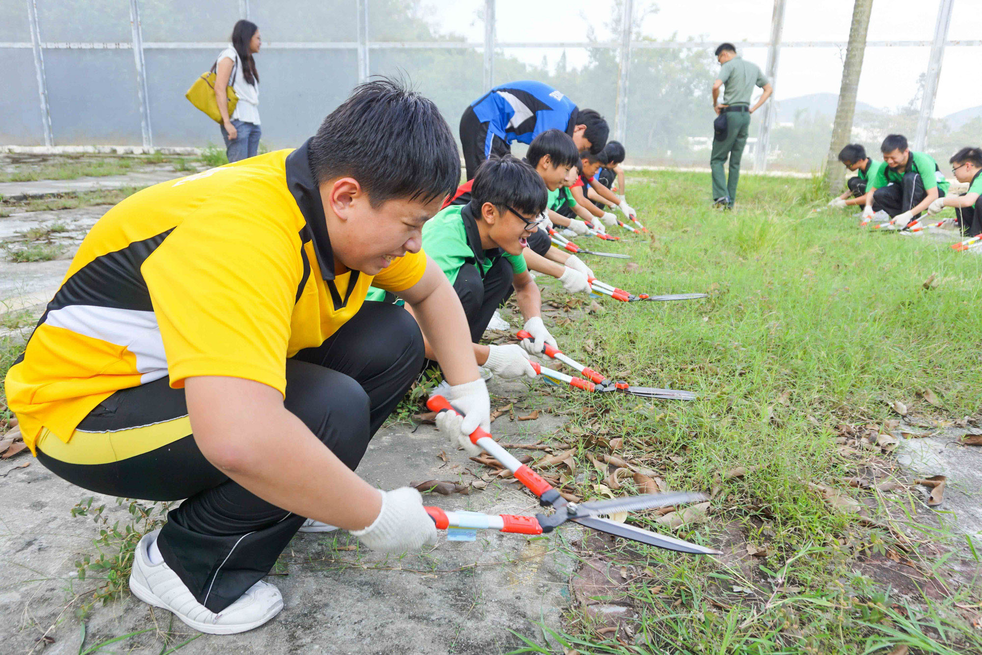 Students experience the life of persons in custody, including simulated grass cutting.