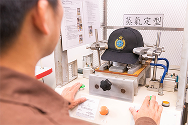 Photo 2 - Uniform caps with easy care features are produced being part of the uniform enhancement programme.