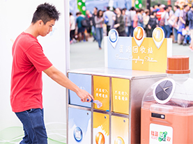 Plastic bottles are put into recycle bin.