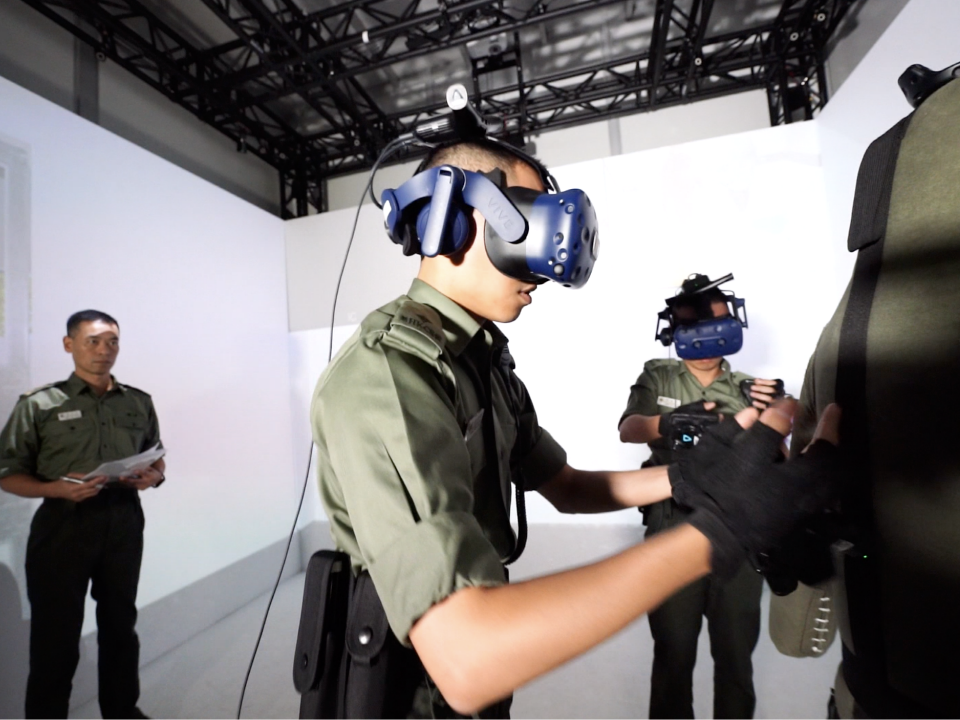 Recruit officers receive scenario training through Virtual Reality Training System.