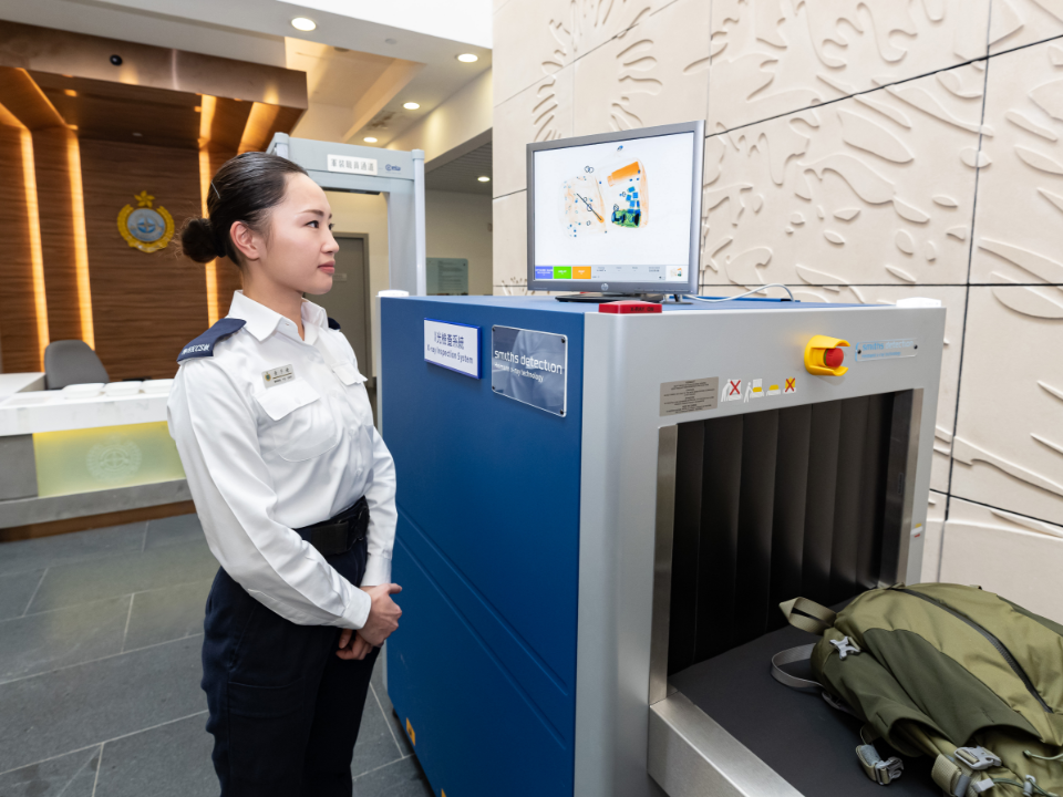 A staff uses the X-ray inspection system to prevent any person from bringing unauthorised articles into the correctional facility.