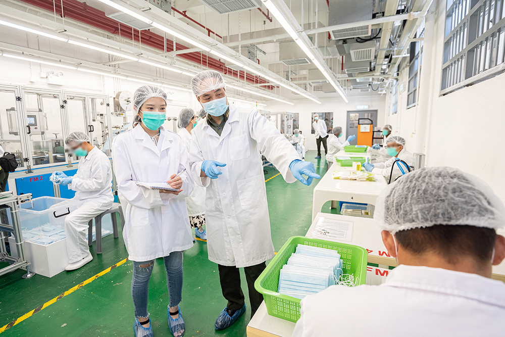 CSD’s General Manager (Industries and Vocational Training), Mr Leung Chi-wai, introduces to the media the operations of the filter mask workshop at Stanley Prison.