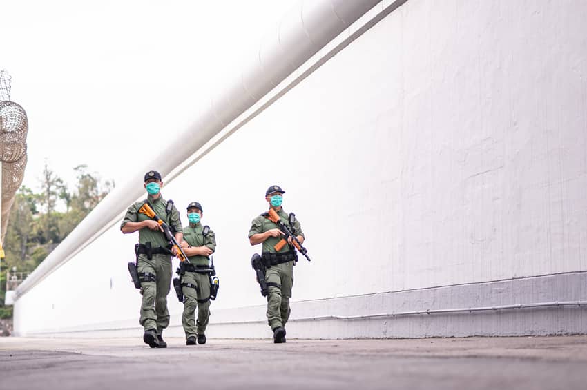 Members of the RRT patrol the peripheral area of a correctional institution.