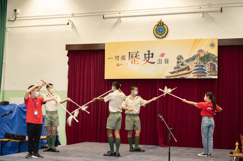 Young persons in custody attend a Cantonese opera class and practise tasselled spear techniques.