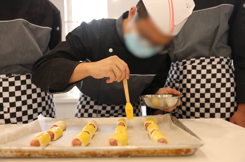 Young persons in custody learn bakery and pastry making skills at the new vocational training workshop “Bake My Way” to equip themselves for return to society in future.