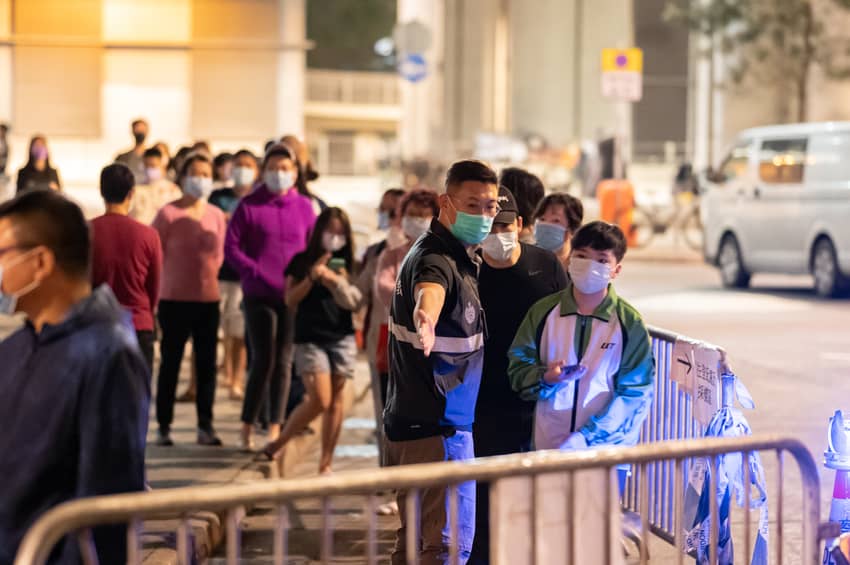 Correctional officers assist residents in undergoing testing within “restricted areas” in Jordan, Yuen Long and Sham Shui Po.