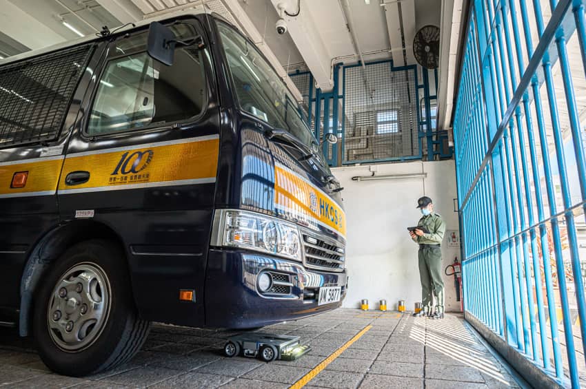 A Vehicle Chassis Inspection Robot performs a security check underneath a vehicle.