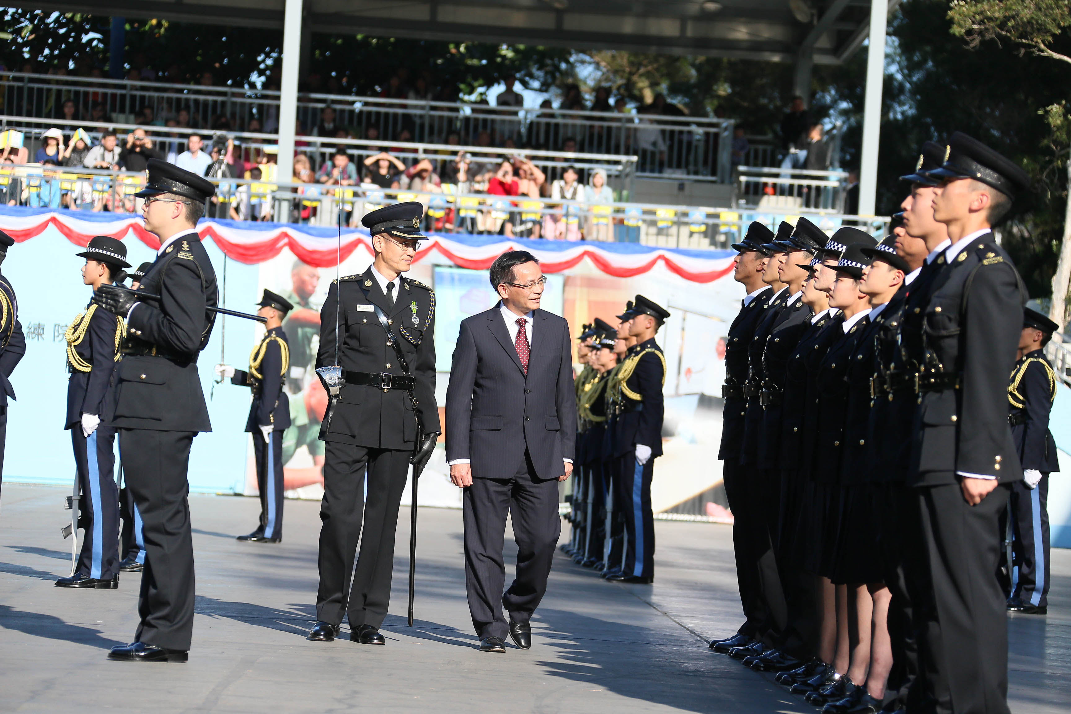 The Chairman of the Legislative Council Panel on Security, Mr Ip Kwok-him, inspects a contingent of correctional officers at the passing-out parade today (February 1). 