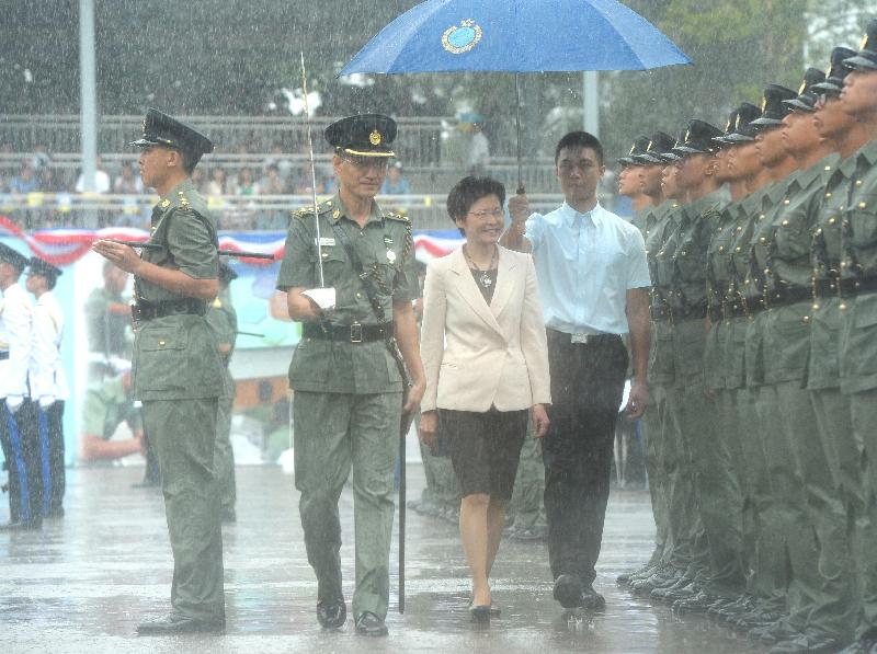 Mrs Lam inspects a contingent of correctional officers at the passing-out parade at the Staff Training Institute of the CSD today.