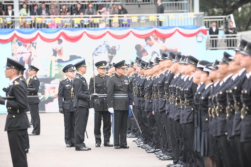 The Commissioner of Correctional Services, Mr Sin Yat-kin, officiates and inspects at the Passing-out cum Commissioner's Farewell Parade of the Correctional Services Department at its Staff Training Institute in Stanley today (December 24).