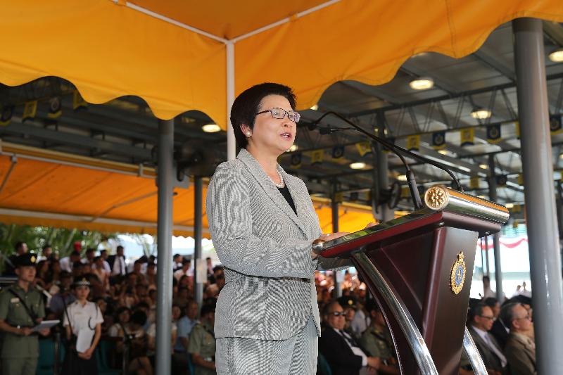 The Chairman of the Public Service Commission, Mrs Rita Lau, addresses a Correctional Services Department (CSD) passing-out parade at the Staff Training Institute of the CSD in Stanley today (June 12).