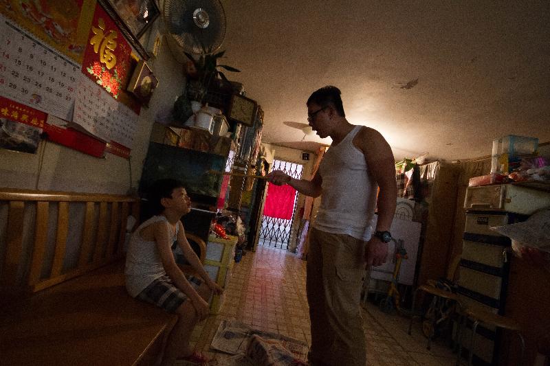 Ah Shing (false name), a 19-year-old trainee at a rehabilitation centre, feels a mixture of love and hate towards his father. Photo shows a reenactment of a past confrontation between Ah Shing and his father.