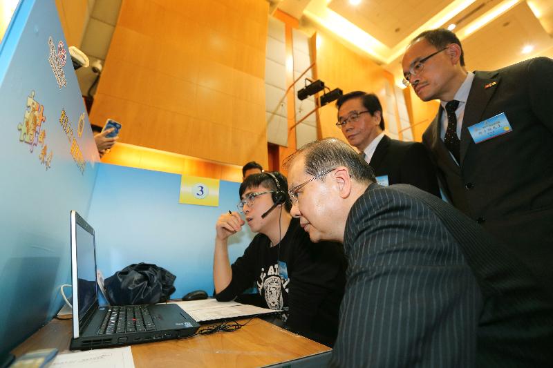 Mr Cheung (front) tours the job fair.