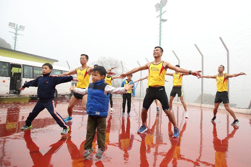 Distance Running Team members, father and son, nurture a second generation of remarkable runners.
