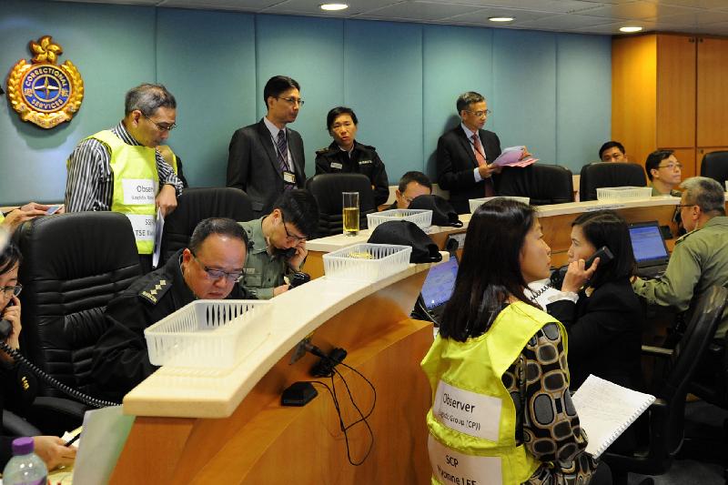 The Correctional Services Department carried out an exercise today (December 21) to test the emergency response efficiency of various units including the newly established Regional Response Team in different scenarios, such as the mass indiscipline of persons in custody and a hostage-taking situation inside Tong Fuk Correctional Institution. Photo shows the department's Central Control Centre in operation during the exercise.