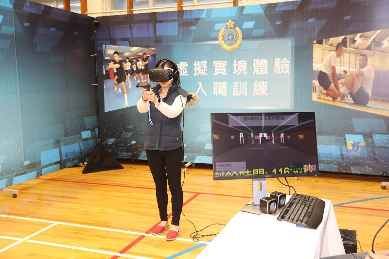 The Correctional Services Department today (March 18) held an Open Day at the Staff Training Institute and the Hong Kong Correctional Services Museum in Stanley to tie in with the 20th anniversary of the establishment of the Hong Kong Special Administrative Region and the 35th anniversary of the Prisons Department's renaming as the Correctional Services Department. Photo shows participants using virtual reality technology to learn more about recruitment training, Regional Response Team training and the work of the Dog Unit.