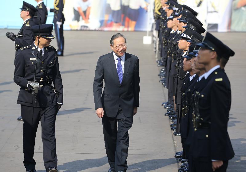 The Secretary for Security, Mr Lai Tung-kwok (centre), inspects a contingent of correctional officers during the Correctional Services Department passing-out parade at its Staff Training Institute in Stanley today (April 28).