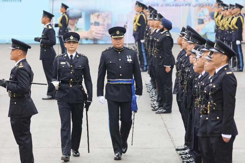 The Correctional Services Department held a passing-out parade at the Staff Training Institute in Stanley today (February 9). Photo shows the Assistant Commissioner of Correctional Services (Rehabilitation), Mr Tang Ping-ming, inspecting a contingent of correctional officers.