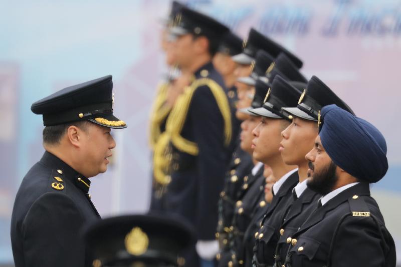 The Correctional Services Department held a passing-out parade at the Staff Training Institute in Stanley today (February 9). Photo shows the Assistant Commissioner of Correctional Services (Rehabilitation), Mr Tang Ping-ming, inspecting a contingent of correctional officers.