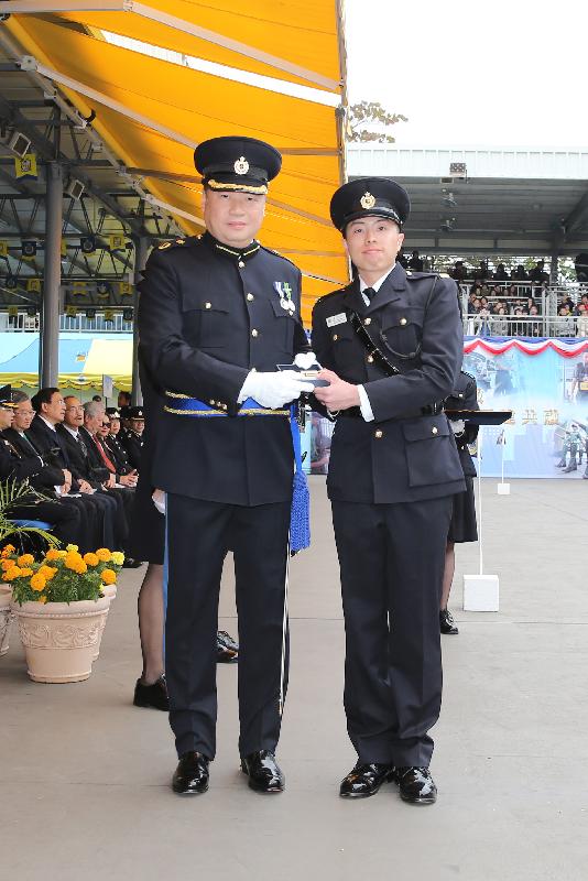 The Correctional Services Department held a passing-out parade at the Staff Training Institute in Stanley today (February 9). Photo shows the Assistant Commissioner of Correctional Services (Rehabilitation), Mr Tang Ping-ming (left), presenting a Best Recruit Award, the Golden Whistle, to Assistant Officer II Mr Tong Tsz-hin.