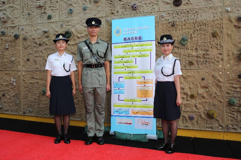 The Correctional Services Department held a passing-out parade at the Staff Training Institute in Stanley today (June 8). Photo shows Assistant Officer II Ms Lam Hoi-ting (left), Officer Mr Siu Cheong-hung (centre) and Officer Ms Tong Lai-sho (right), who spoke to the media after the parade.