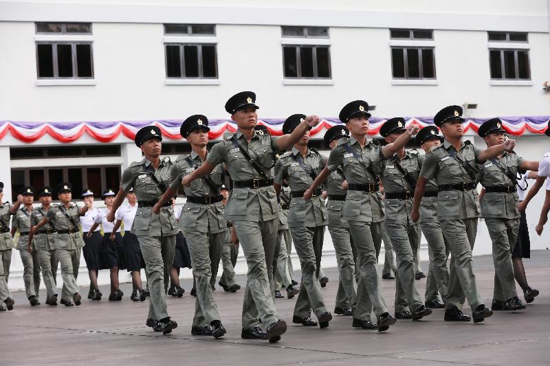 The Correctional Services Department held a passing-out parade at the Staff Training Institute in Stanley today (August 2). Photo shows the parade marching past the dais.