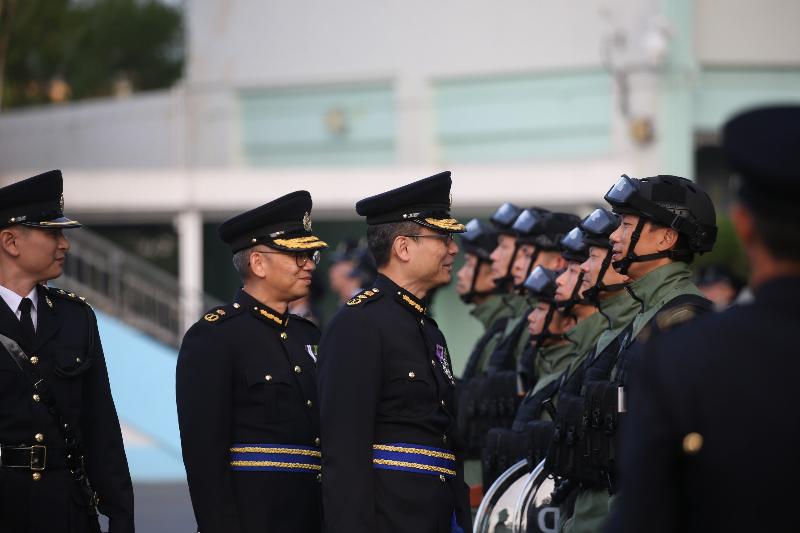 The Commissioner of Correctional Services, Mr Lam Kwok-leung (third left), inspects a contingent of correctional officers during the Passing-out cum Commissioner's Farewell Parade of the Correctional Services Department at its Staff Training Institute in Stanley today (November 23).