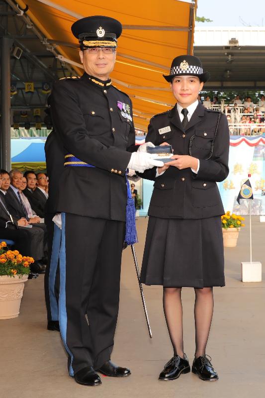 The Commissioner of Correctional Services, Mr Lam Kwok-leung (left), presents a Best Recruit Award, the Golden Whistle, to Assistant Officer II Miss Yu Pui-shan at the Passing-out cum Commissioner's Farewell Parade of the Correctional Services Department at its Staff Training Institute in Stanley today (November 23).