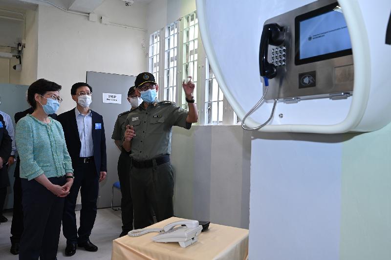 The Chief Executive, Mrs Carrie Lam, officiated at the "Smart Prison" launching ceremony at Tai Tam Gap Correctional Institution of the Correctional Services Department today (May 22). Photo shows Mrs Lam (first left) and the Secretary for Security, Mr John Lee (second left), being briefed by the Commissioner of Correctional Services, Mr Woo Ying-ming (first right), on the Integrated Intelligent Communication System, which allows persons in custody to make phone calls to designated persons by themselves.