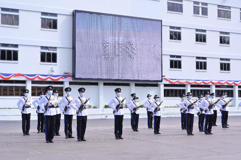 The Correctional Services Department held a passing-out parade at the Staff Training Institute in Stanley today (June 11). Photo shows correctional officers marching and forming the number "100" to mark the 100th anniversary of the department.