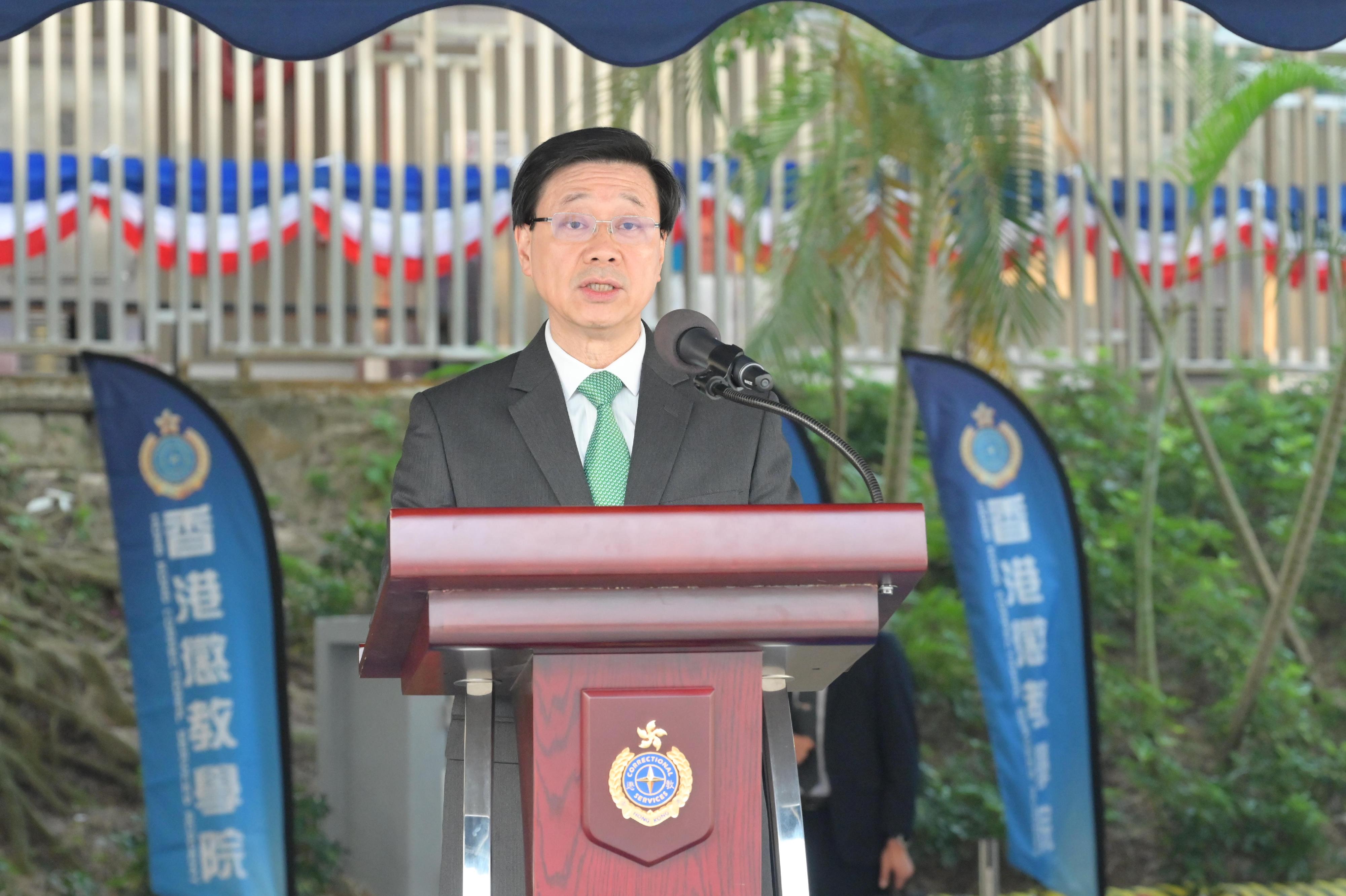 The Chief Executive, Mr John Lee, speaks at the Correctional Services Department passing-out parade today (November 24).