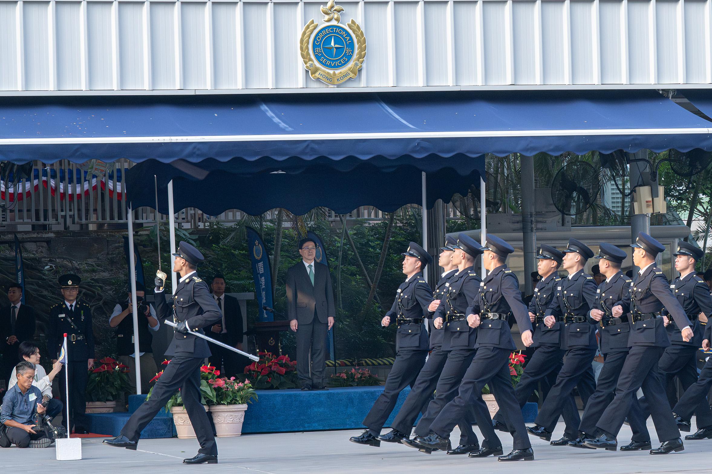 The Correctional Services Department held a passing-out parade at the Hong Kong Correctional Services Academy today (November 24). Photo shows the parade marching past the dais.