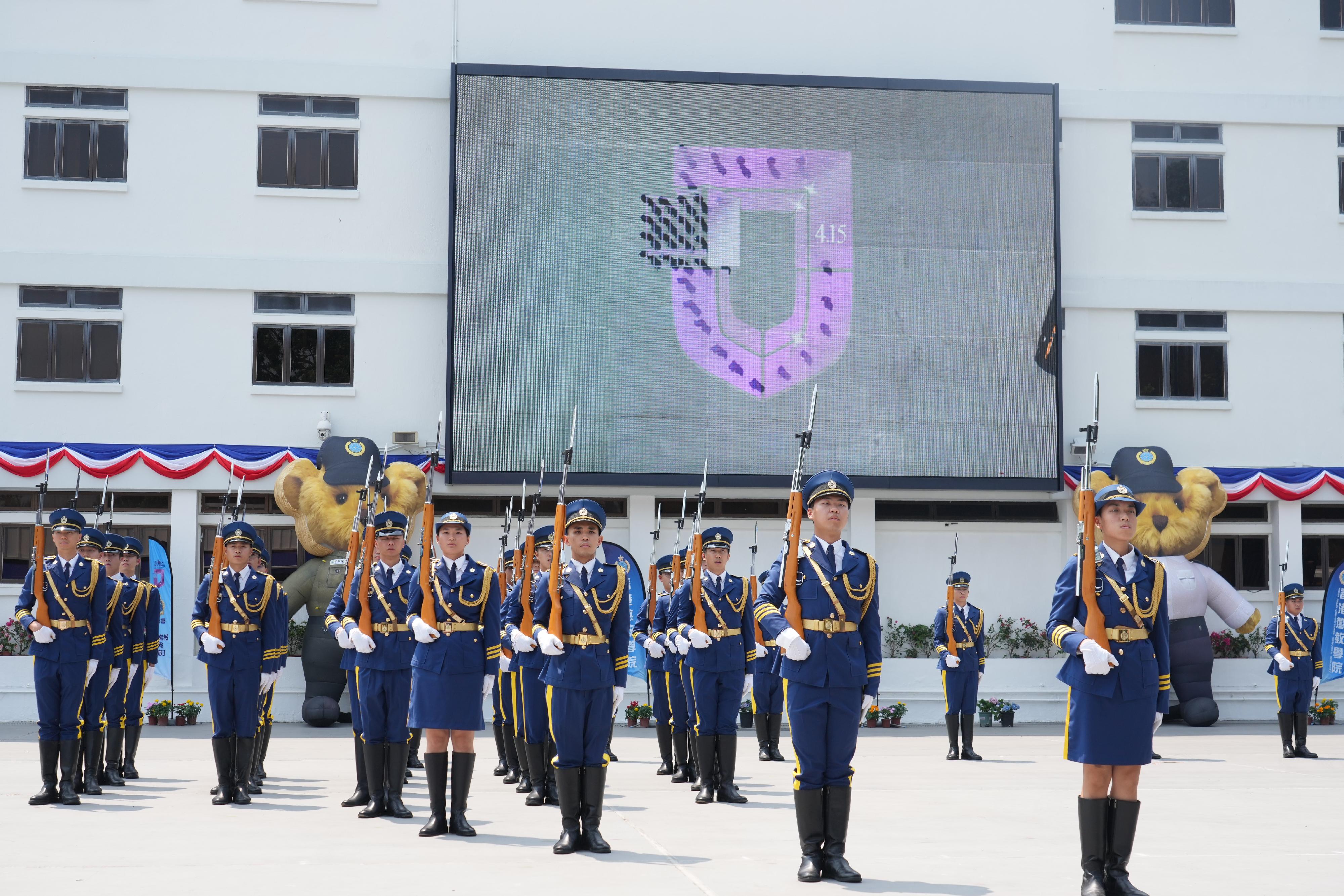 To support National Security Education Day on April 15, the Correctional Services Department held an open day at the Hong Kong Correctional Services Academy today (April 13) to raise public awareness of national security and enhance public understanding of its work in safeguarding national security. Photo shows correctional officers assembling to form the shield logo of National Security Education Day.