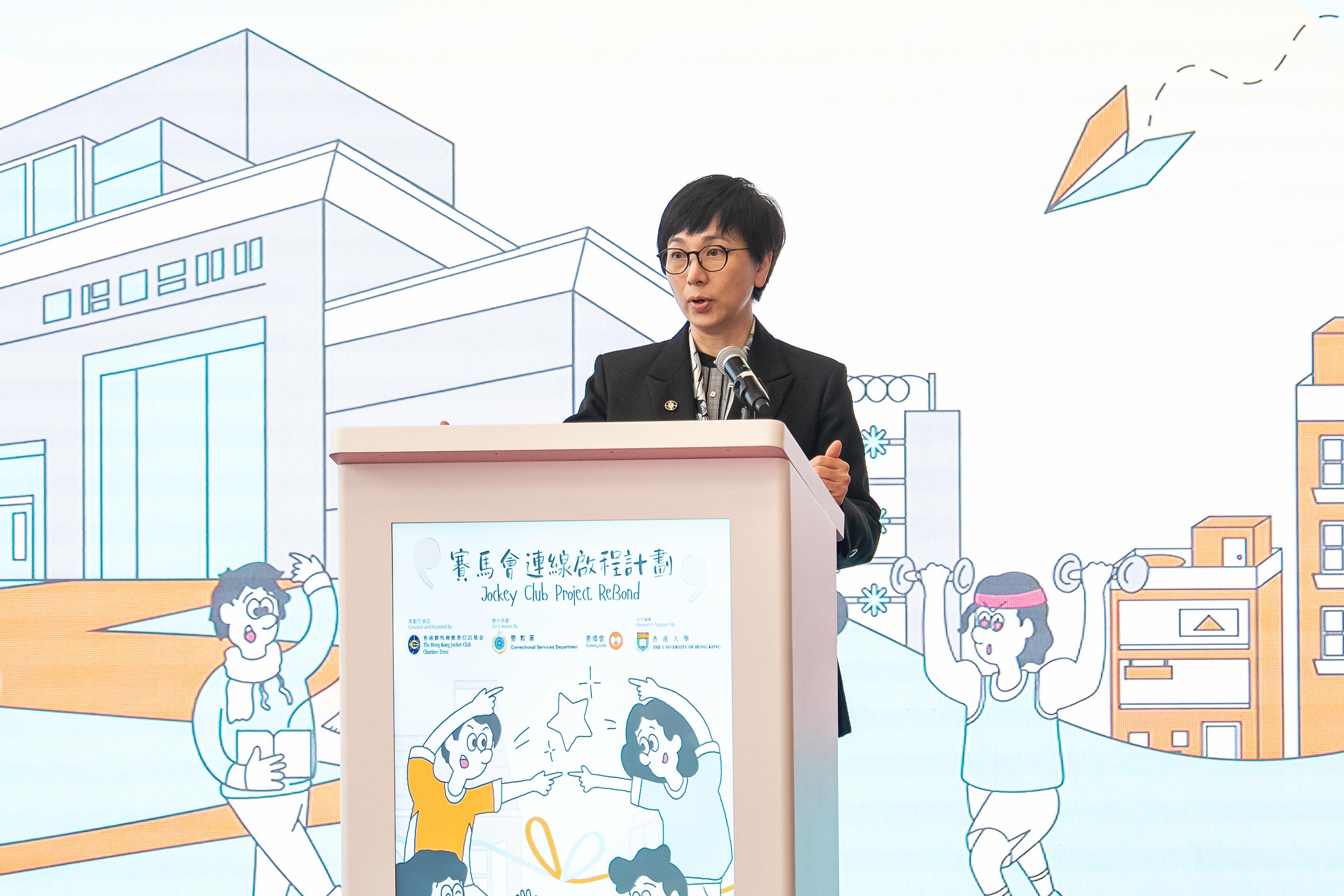 The Correctional Services Department held the Jockey Club Project ReBond kick-off ceremony at Lo Wu Correctional Institution today (October 23). The project provides one-stop rehabilitation services for persons in custody serving sentences of less than one year, covering both their incarceration and post-release periods, and will track and research their rehabilitation situation. Photo shows the Head of Charities (Education & Youth Cluster) of The Hong Kong Jockey Club, Ms Winnie Ying, delivering a speech at the kick-off ceremony.