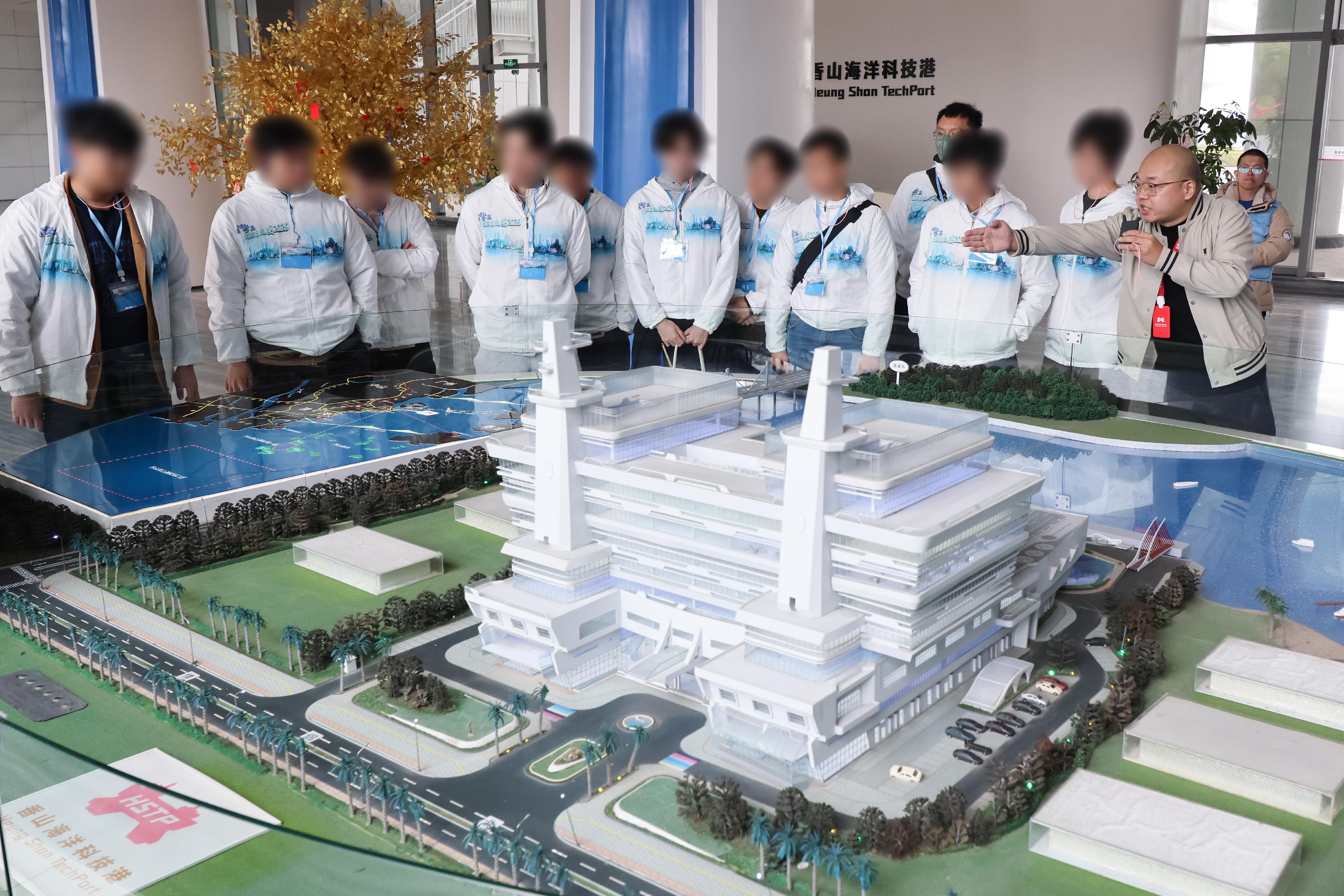 To further cultivate national consciousness and positive values in young rehabilitated persons, correctional officers led youths who have completed their sentences and are under statutory supervision to participate in the Greater Bay Area Experience Exchange Tour 2026, visiting Foshan and Zhuhai in the Guangdong-Hong Kong-Macao Greater Bay Area for three days and two nights of exchanges, so that they could learn about the country&rsquo;s history and culture as well as its developments in various fields. Photo shows young rehabilitated persons visiting an intelligent technology company in Zhuhai today (February 9) to learn about the nation&rsquo;s research, development and application of unmanned surface vessels.