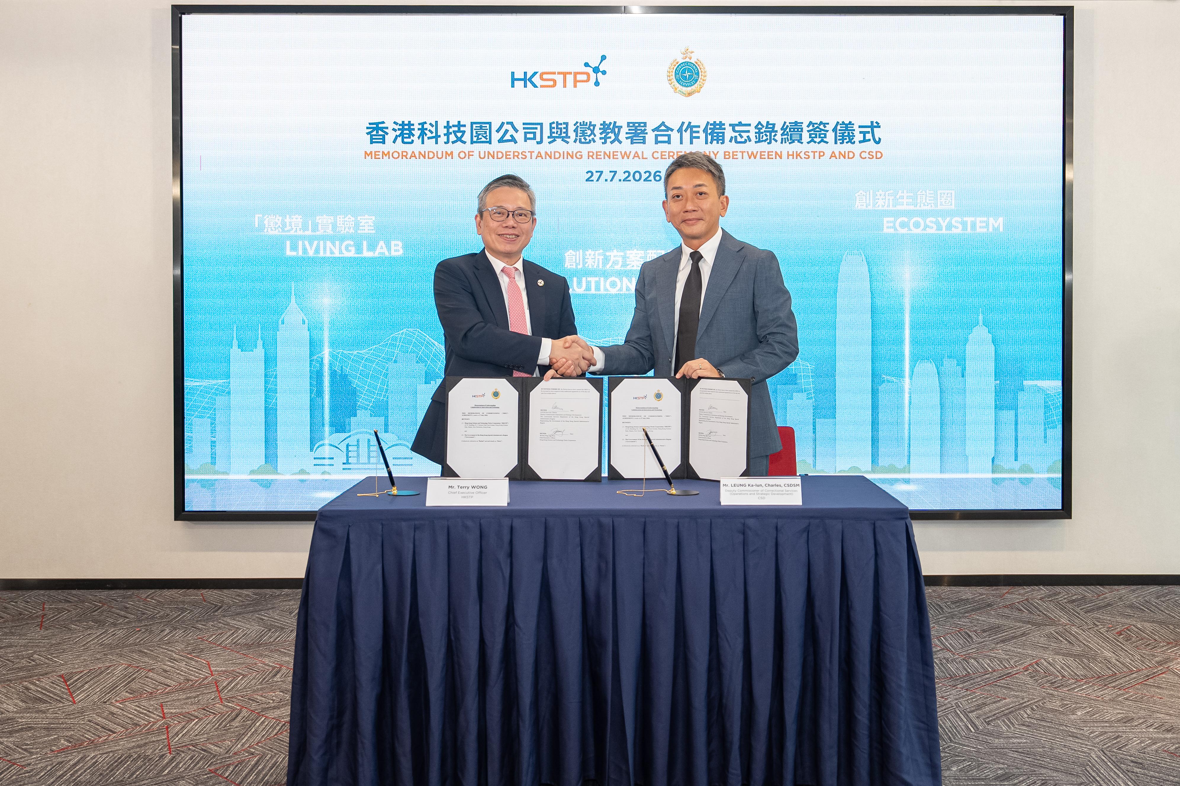 The Correctional Services Department and the Hong Kong Science and Technology Parks Corporation (HKSTP) renewed a three-year Memorandum of Understanding (MOU) today (July 27) to deepen the sustainable development of Smart Prison in correctional institutions. Photo shows the Deputy Commissioner of Correctional Services (Operations and Strategic Development), Mr Leung Ka-lun (right), posing with the Chief Executive Officer of the HKSTP, Mr Terry Wong (left), after the renewal of the MOU.