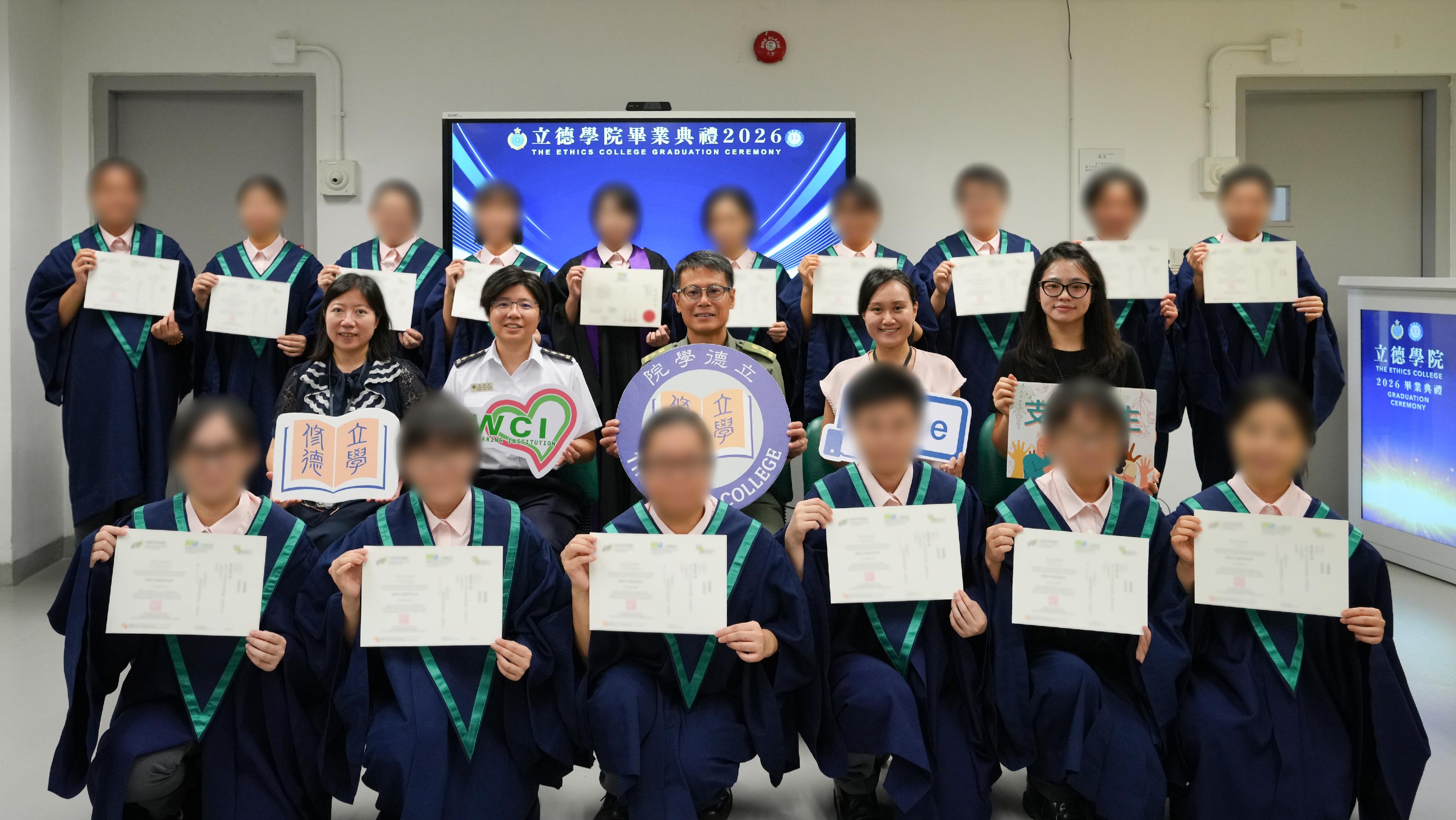 The Correctional Services Department established the Ethics College at Pak Sha Wan Correctional Institution and Lo Wu Correctional Institution, providing persons in custody (PICs) with suitable programmes. Photo shows the Senior Superintendent of Lo Wu Correctional Institution, Mr Lau Yee-kan (centre, second row), with PIC graduates of the inaugural Associate of General Studies programme and the Diploma of Applied Education programme offered by the Ethics College after certificate presentation at Lo Wu Correctional Institution today (August 5).
