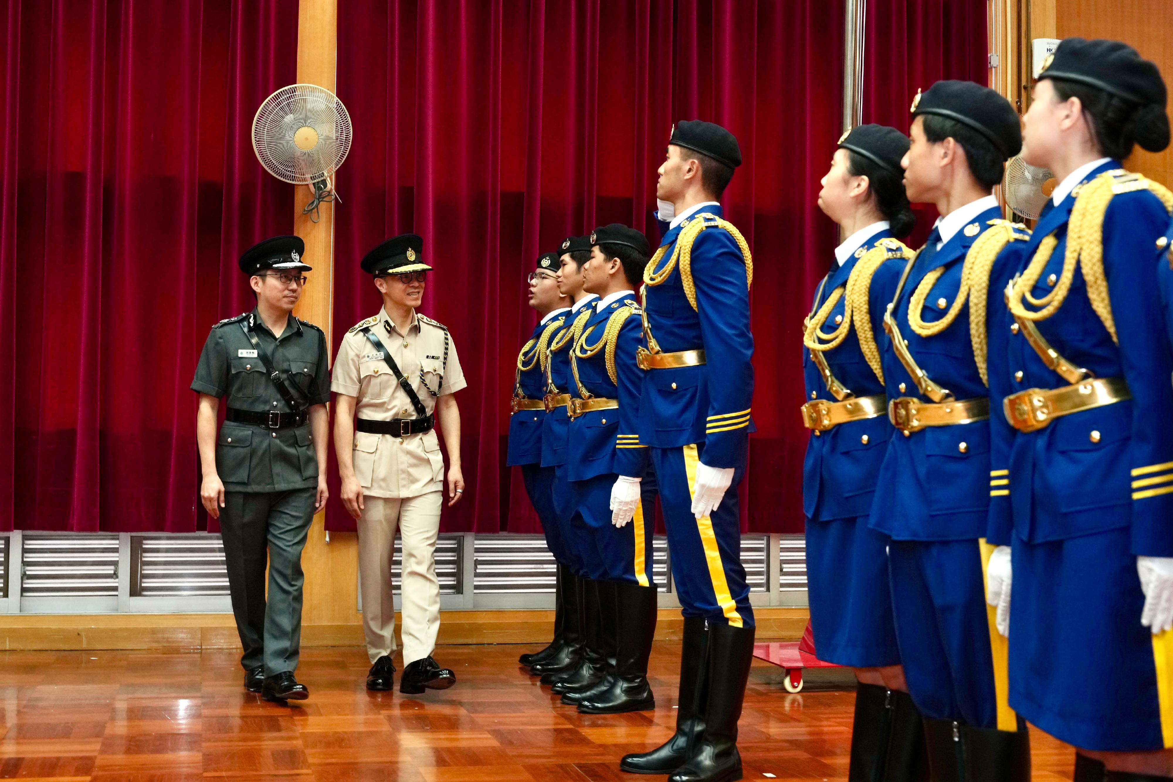 The Correctional Services Department today (October 3) held the Inauguration Ceremony for the Honorary Advisory Committee of the Correctional Services Pioneer Leaders (CSPL) and Trainees Promotion Ceremony to appoint new committee members and commend outstanding trainees. Photo shows the Commissioner of Correctional Services, Mr Wong Kwok-hing (second left), accompanied by the Honorary Director of the CSPL Honorary Advisory Committee, Mr Sunny Sy (first left), inspecting a contingent of promoted CSPL trainees.