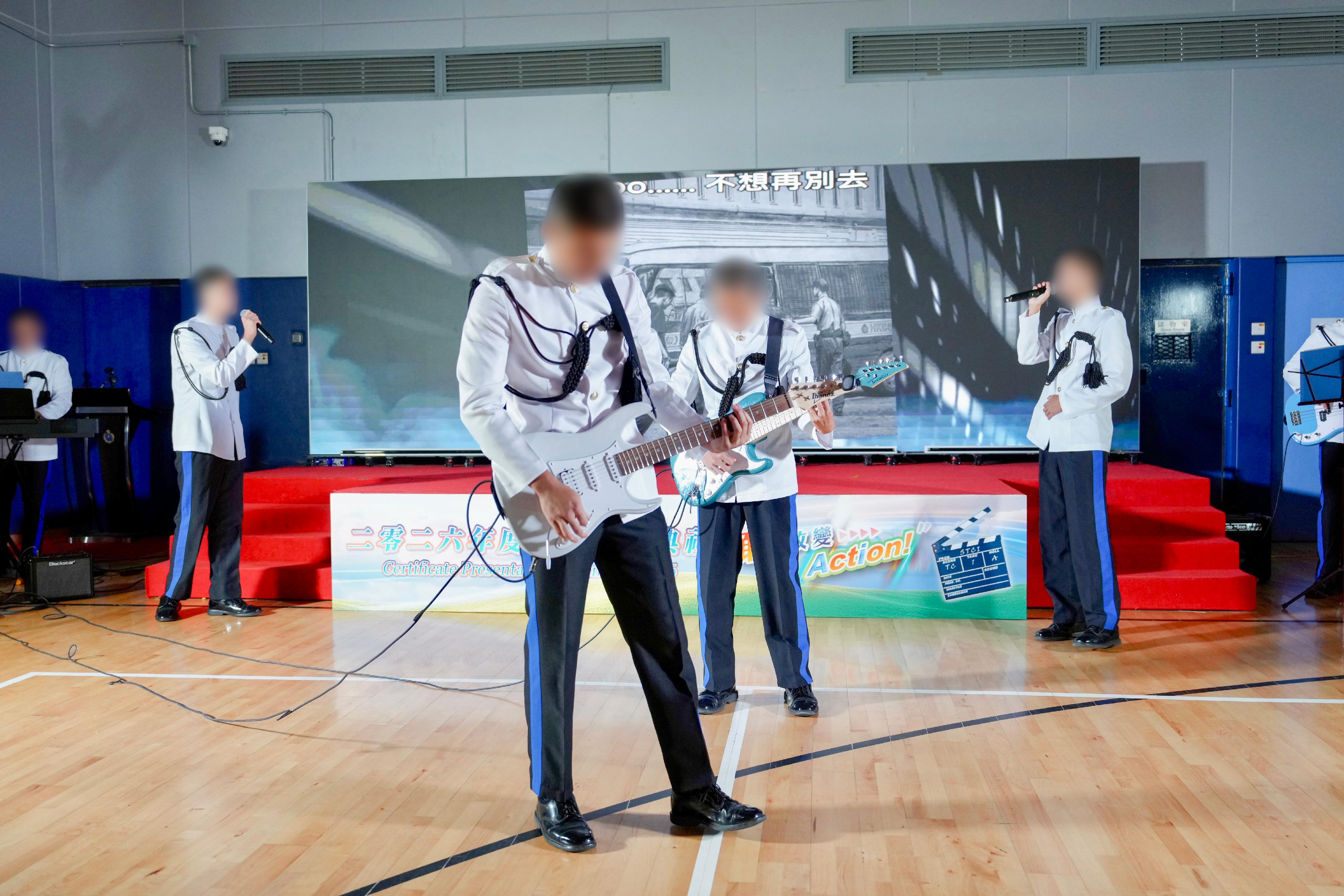 Young persons in custody at Sha Tsui Correctional Institution of the Correctional Services Department were presented with certificates at a ceremony today (October 28) in recognition of their efforts and achievements in studies and vocational examinations. Photo shows a musical performance delivered by young persons in custody. 