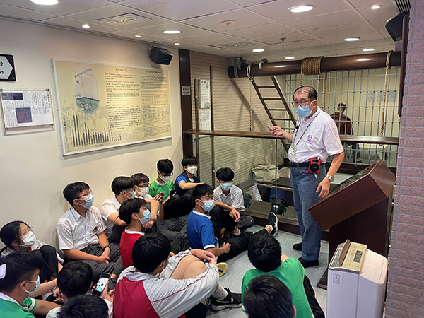 Students listening to the history of correctional services in Hong Kong