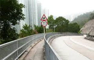 Traffic sign post and railing in Hong Kong